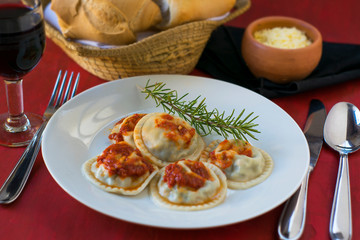 Making homemade pasta: Large round ravioli (Sorrentino) cooked, served on a dish, ready to eat