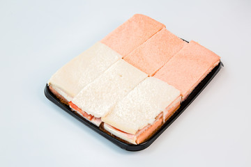 sandwiches on a black tray with white background