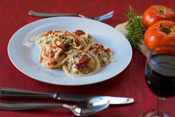 Making homemade pasta: Large round ravioli (Sorrentino) cooked, served on a dish, ready to eat