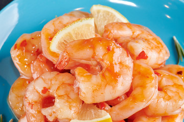 Shrimp cocktail background with close - up view of a group of fresh delicious chilled crustaceans as exquisite seafood for a party or dinner at a restaurant serving dishes from the sea.