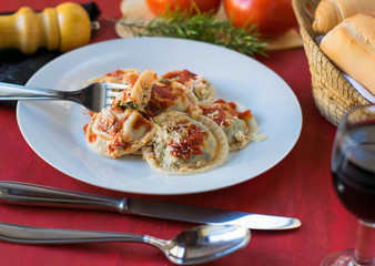 Making homemade pasta: Large round ravioli (Sorrentino) cooked, served on a dish, ready to eat