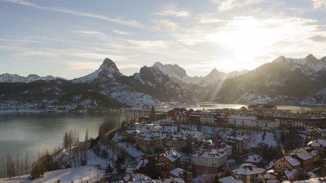 Day to Night Time Lapse of mountain village covered in snow. Riano, Spain