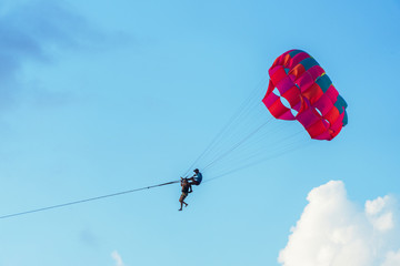 Evening parasailing on the beach of Patong, Phuket province, Kingdom of Thailand