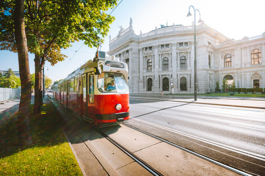 Vienna tram with Burgtheater at sunrise, Vienna, Austria