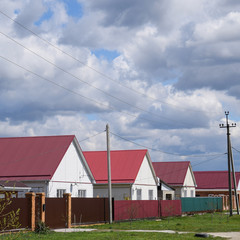Obraz premium The roof of corrugated sheet on the houses