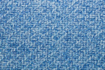 Blue and white knitting fabric texture or background, soft melange cloth, closeup