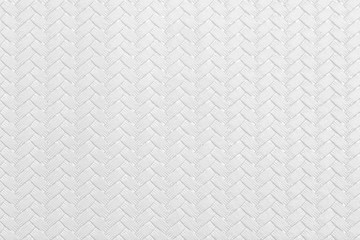 Textured white leather background with wickerwork cable pattern