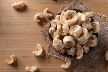 Pork rinds also known as chicharon or chicharrones , kab moo