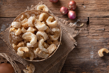 Pork rinds also known as chicharon or chicharrones , kab moo