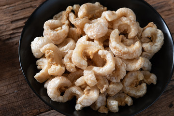 Pork rinds also known as chicharon or chicharrones , kab moo