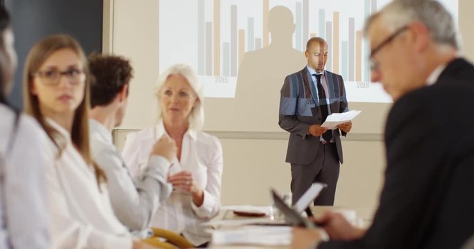 4k, African American businessman quits during a rather boring boardroom meeting. Slow motion