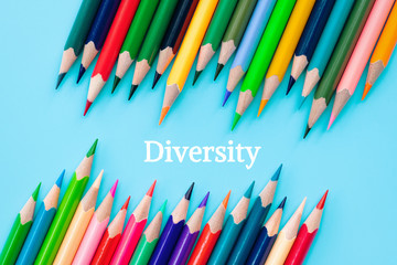 Diversity concept. row of mix color pencil on blue background