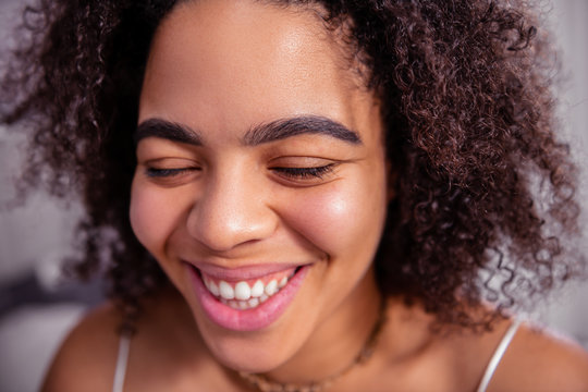 Curly African American Woman With Thick Bushy Brows