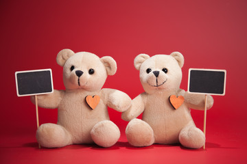 Couple Teddy Bears on red background. Valentines Day card. Love heart.