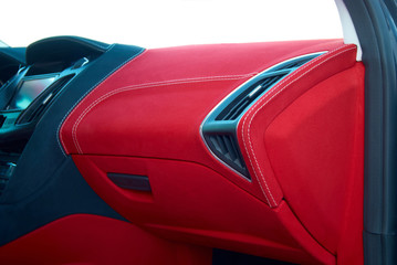 Car deflector. Car interior details. Red and black alcantara with stitching - obrazy, fototapety, plakaty