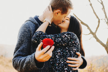 Couple kissing after proposal