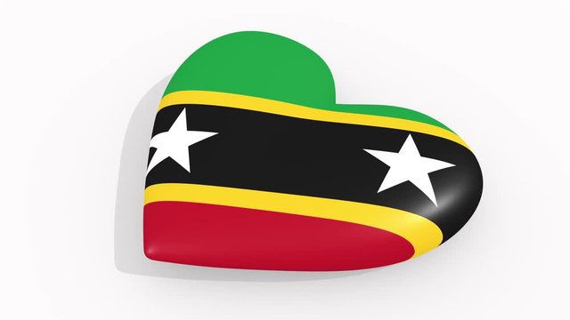 Heart in colors and symbols of Saint Kitts and Nevis on white background, loop