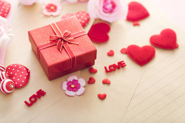 Valentine Day gift box with red hearts and roses on letter envelope