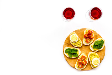 Healthy snacks. Set of toasts with vegetables like avocado, guacamole, rocket, cherry tomatoes on white background top view copy space