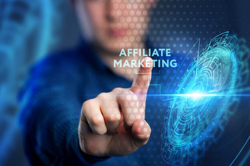 The concept of business, technology, the Internet and the network. A young entrepreneur working on a virtual screen of the future and sees the inscription: Affiliate marketing