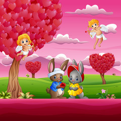 Couple a rabbit in the beautiful pink garden