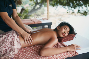 Back Massage At Thai Spa. Woman Having Body Massage At Salon