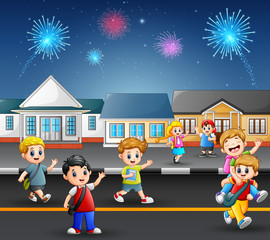 Happy school children playing in the street of a suburban neighborhood 
