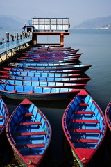 Blue boats and still water