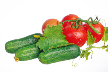 Vegetables on a white background. Tomatoes and cucumbers