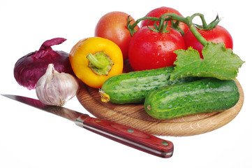 Vegetables on a white background. Cabbage, cucumbers, tomatoes, peppers, onions, garlic