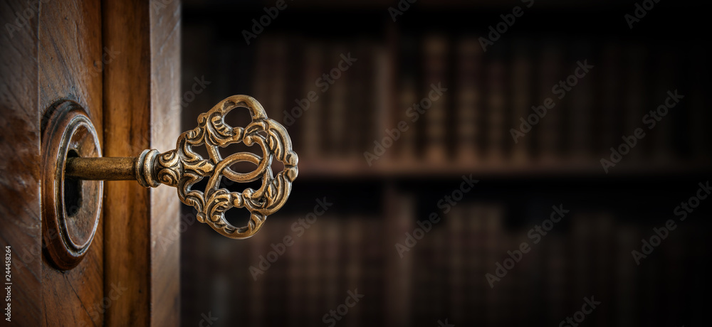 Poster old key in keyhole, macro shot. retro style. concept and idea for history, business, security backgr