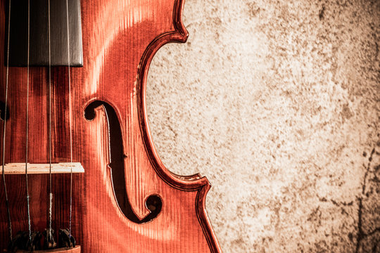 violin on cement wall, music background