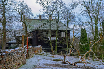 Traditional wooden house made of resin-impregnated logs in Skansen open-air Museum. Stockholm, Sweden.