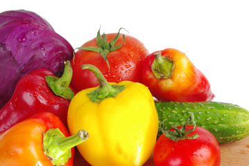 Vegetables on a white background. Cabbage, cucumbers, tomatoes, peppers, onions, garlic