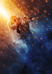 Man break dancing on smoke background