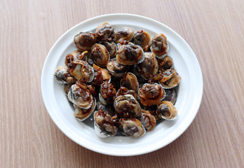 Boiled cockle cooked with soy sauce.