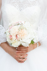 bridal bouquet in the hands of the bride