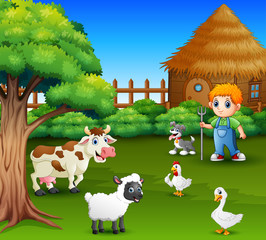 Obraz na płótnie Canvas A farmer at his farm with a bunch of farm animals