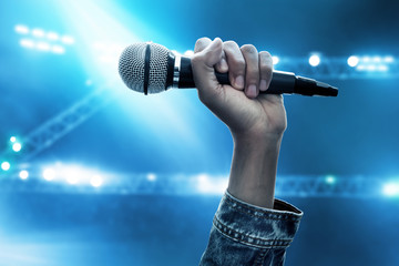 Hand holding microphone
