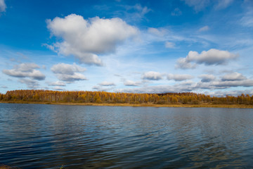 Autumn landscape - lake, clouds and forest