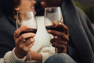 Couple having wine on picnic