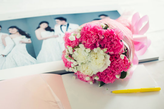 bouquet on the wedding photo book