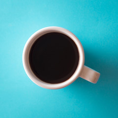 Obraz na płótnie Canvas cup of coffee on blue background