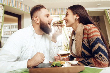 Happy man and woman having lunch in a restaurant