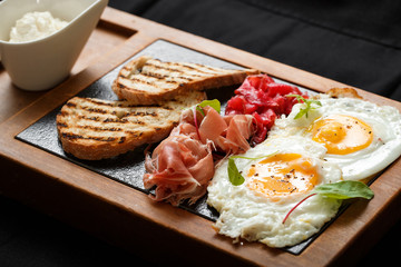 Close up breakfast eggs and toast jamon and cheese