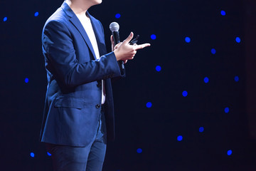 speaker on stage in a conference room