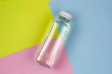 top view flat lay water bottle on a vibrant background