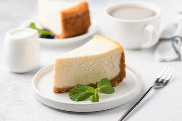 Tasty Cheesecake with Coffee on white plate. Cake and coffee. Coffee time. Selective focus - obrazy, fototapety, plakaty