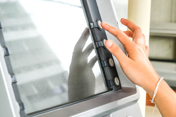 Close up of hand entering pin at an ATM. ATM for withdraw your money in the outside