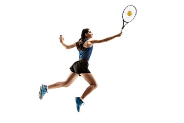 Full length portrait of young woman playing tennis isolated on white background. Healthy lifestyle. The practicing, fitness, sport, exercise concept. The female model in motion or movement